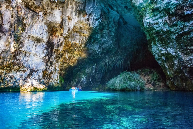 Entering the large Melissani Cave via a rowboat