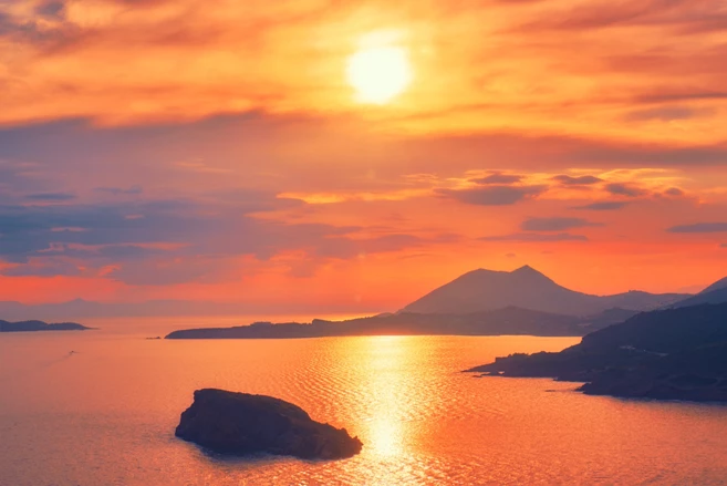 Aegean Sea with Greek islands view on sunset. Cape Sounion, Greece